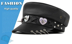 Detail view of black PU leather baker boy hat with metal rings and punk heart sequins
