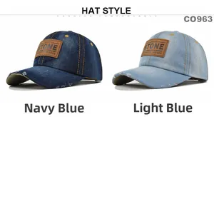 Detail of navy and light blue distressed denim caps with vintage leather patches