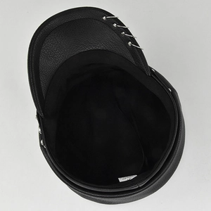 Detail view of the black PU leather military cap featuring inner lining and 100% PU label