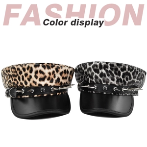 Detail of leopard print military caps with punk style leather straps and silver metal studs