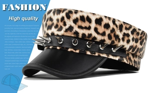 Detail of leopard print military cap with black leather brim and silver metal studs