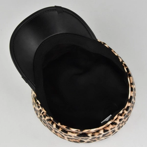 Detailed top view of leopard print baker boy hat with black brim and inner lining