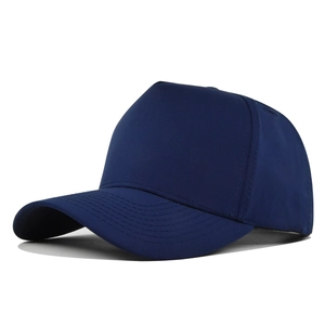 Detail of navy blue five-panel baseball cap showing curved brim and stitching