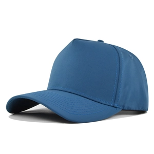Detailed close-up of navy blue 5-panel baseball cap showing reinforced brim stitching