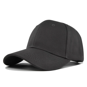 Close-up of black cotton baseball cap showing reinforced stitching and curved brim