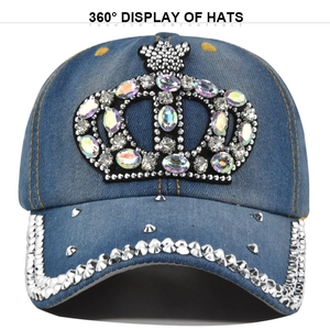 Close-up of blue denim baseball cap with rhinestone crown patch and studded brim detail