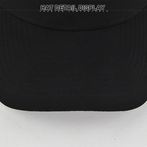 Detailed close-up of a black baseball cap brim with precise six-row parallel stitching detail