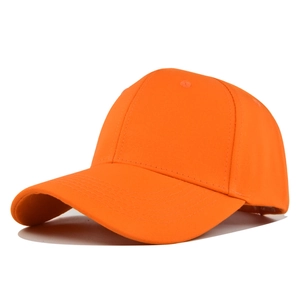 Detailed top view of a classic orange 6-panel cotton baseball cap with ventilation eyelets