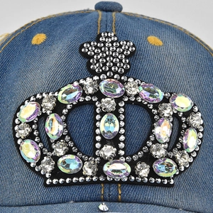 Blue denim baseball cap with a sparkling rhinestone crown and contrast stitching detail