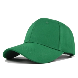 Macro detail of the six-panel structure and breathable eyelets on a green cotton baseball cap