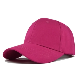 Detail of rose pink cotton baseball cap featuring six-panel structure and vent holes