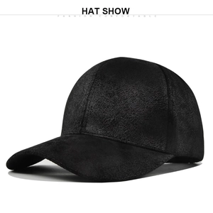 Close-up of black suede baseball cap texture showing fine matte finish and stitching