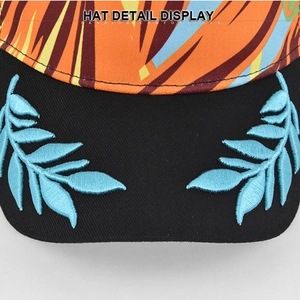 Mesh baseball cap with 3D leaf embroidery and tropical print detail on the brim