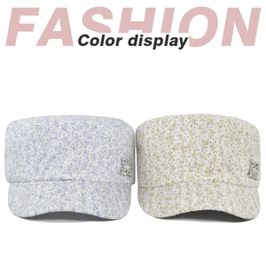 Flat top cadet hats in blue and light green floral patterns with rhinestone side buckles
