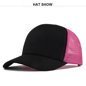 Detail of breathable pink mesh and black cotton peak on the classic trucker cap