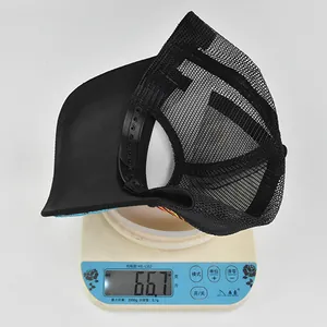 Detailed view of lightweight mesh baseball cap on scale showing 66.7g weight