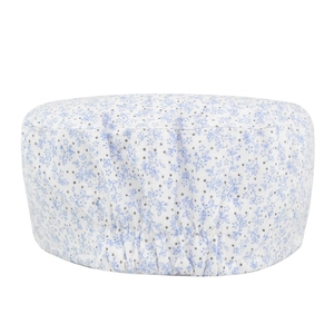 Flat top cap with light blue floral pattern and elastic band on white background