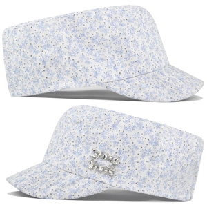 Detail of floral cadet hat featuring a sparkling rhinestone buckle on white canvas