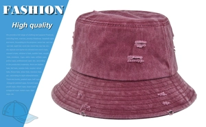 Close-up of wine red washed canvas bucket hat featuring distressed torn edge details