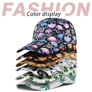 Vertical stack of colorful baseball caps featuring skull and Halloween pumpkin prints