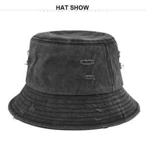 Detail of washed dark grey canvas bucket hat featuring distressed ripped edges and stitching