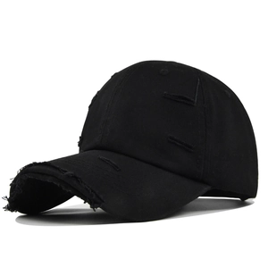 Distressed black cotton baseball cap with ripped holes and vintage streetwear style