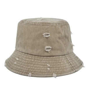 Unisex distressed washed khaki canvas bucket hat with ripped edges and vintage style