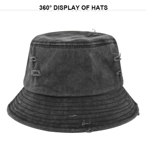 Detail view of washed black denim bucket hat showing vintage distressed ripped fabric texture
