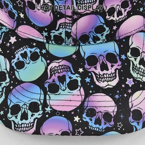 Detail view of colorful gradient skull and star patterns on black trucker hat fabric