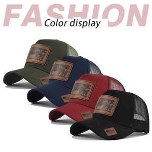 Detail view of four mesh trucker hats in various colors with embossed leather patches