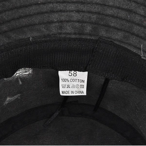 Close-up of the internal breathable sweatband and cotton wash label on the bucket hat