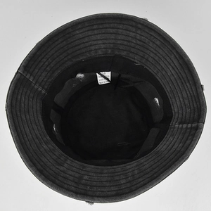 Detail view of cotton bucket hat interior with size 58 label and sweatband