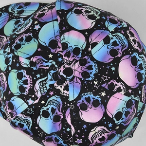 Top view detail of baseball cap showing skull and star print with gradient macaron colors