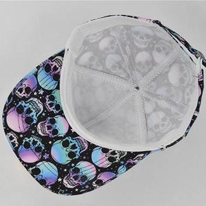 Detail view of baseball cap showing internal white seam structure and colorful skull prints