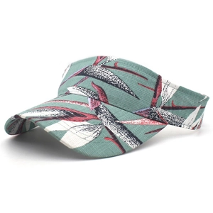 Detail of sage green sun visor with tropical floral pattern and ripstop fabric texture