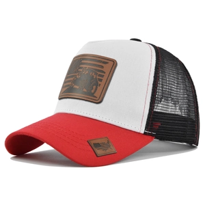 Detail of red truck driver cap with tractor leather patch and American flag motif