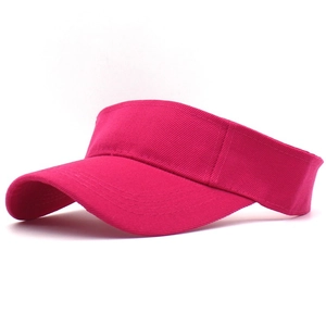 Detail of rose red cotton sun visor showing curved brim and reinforced stitching lines