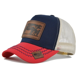 Detail of tricolor trucker hat featuring leather cow patch and breathable white mesh