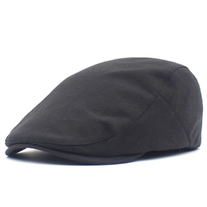 Classic black cotton newsboy cap for men with a flat brim and retro vintage style design