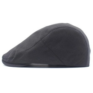 Side view of a classic black cotton flat cap with high-quality stitching and visor detail