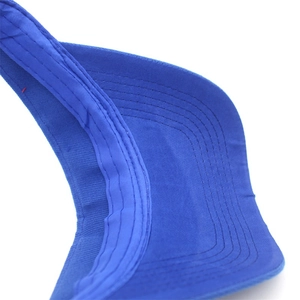 Detailed macro view of the royal blue sports sun visor with reinforced brim stitching