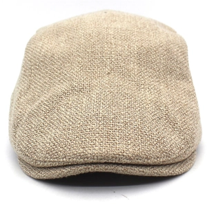 Macro shot of khaki cotton linen flat cap showing detailed coarse woven fabric texture