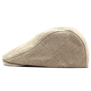 Detailed macro view of the breathable cotton linen texture on this beige flat cap