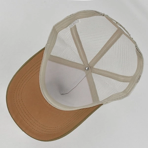 Internal view of trucker hat showing breathable mesh, sweatband and inner stitching details