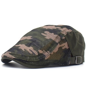 Detail view of breathable camouflage mesh fabric and metal side buckle on the cap