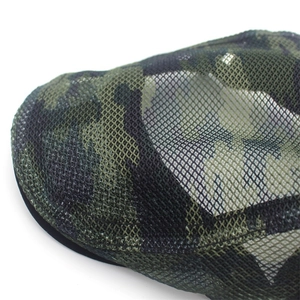 Close-up of camo mesh fabric detail showing breathable double-layer honeycomb structure