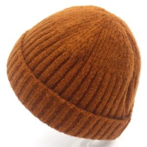 Minimalist caramel knitted beanie hat with chunky vertical ribs and cuffed brim detail