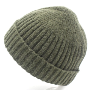 Close-up of military green ribbed knit beanie showing soft wool-like texture and weave