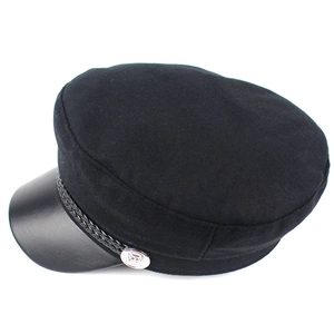 Detail of black newsboy hat with faux leather brim, woven rope and silver metal button