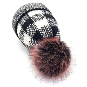 Women's plaid knit beanie with a large faux fox fur pompom for winter warmth